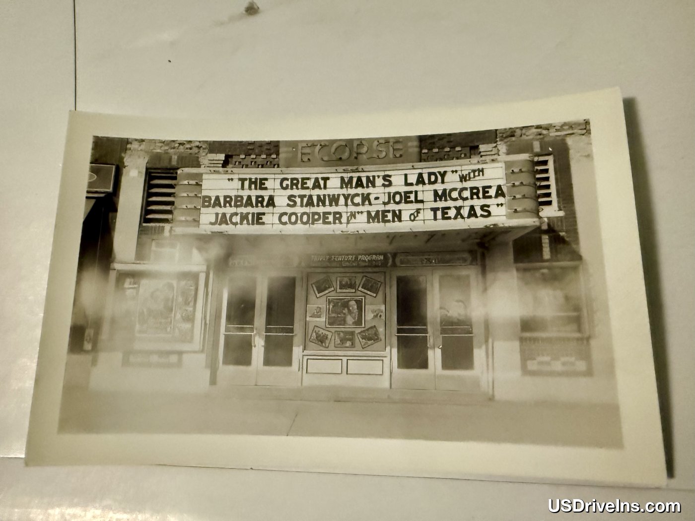 Ecorse Theatre marquee closeup — lobby card displays and entrance, circa 1942
